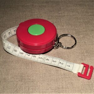 Ruban centimètre rouge enrouleur couture automatique 150 cm avec porte clé