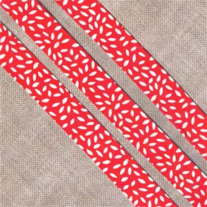 Ruban Biais fantaisie 20mm fond rouge avec des feuilles blanches