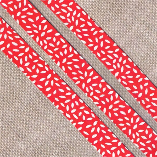 Ruban Biais fantaisie 20mm fond rouge avec des feuilles blanches